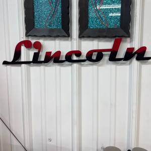 Two toned black and red powder coated Lincoln Sign